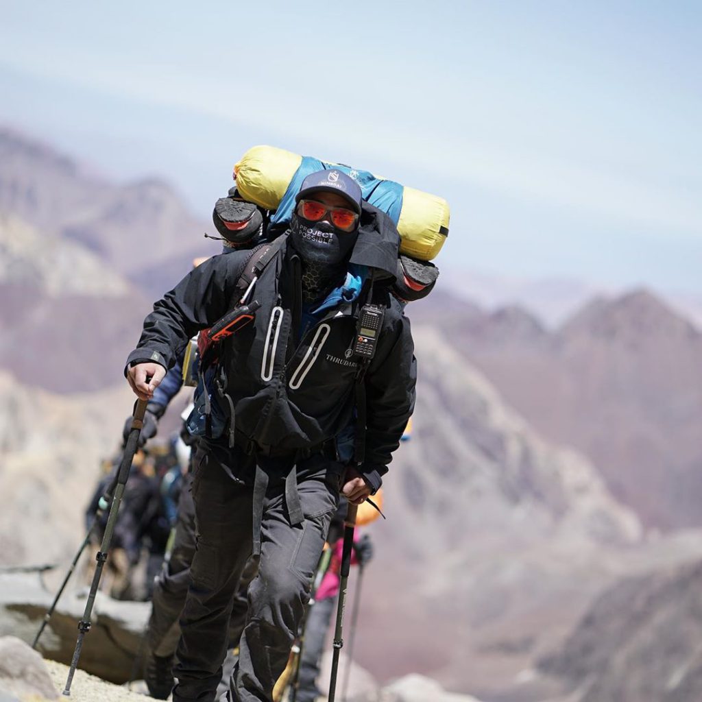 Purja wearing a Thrudark black waterproof SF Skirmish jacket leading an expedition in the mountains