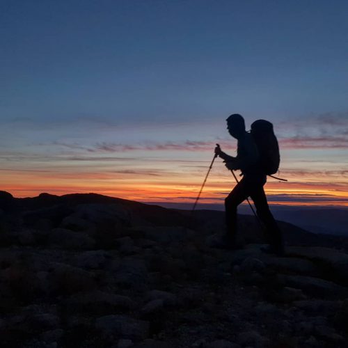 James Forrest Mountain Men / hiking with poles during sunset